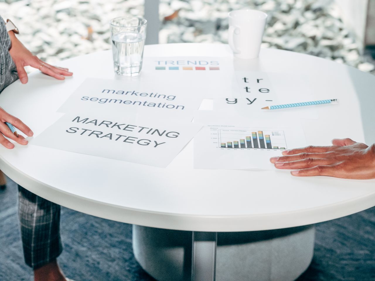 Crafting Captivating Headlines: Your awesome post title goes here Two professionals collaborate on marketing strategy and segmentation at a round table.
